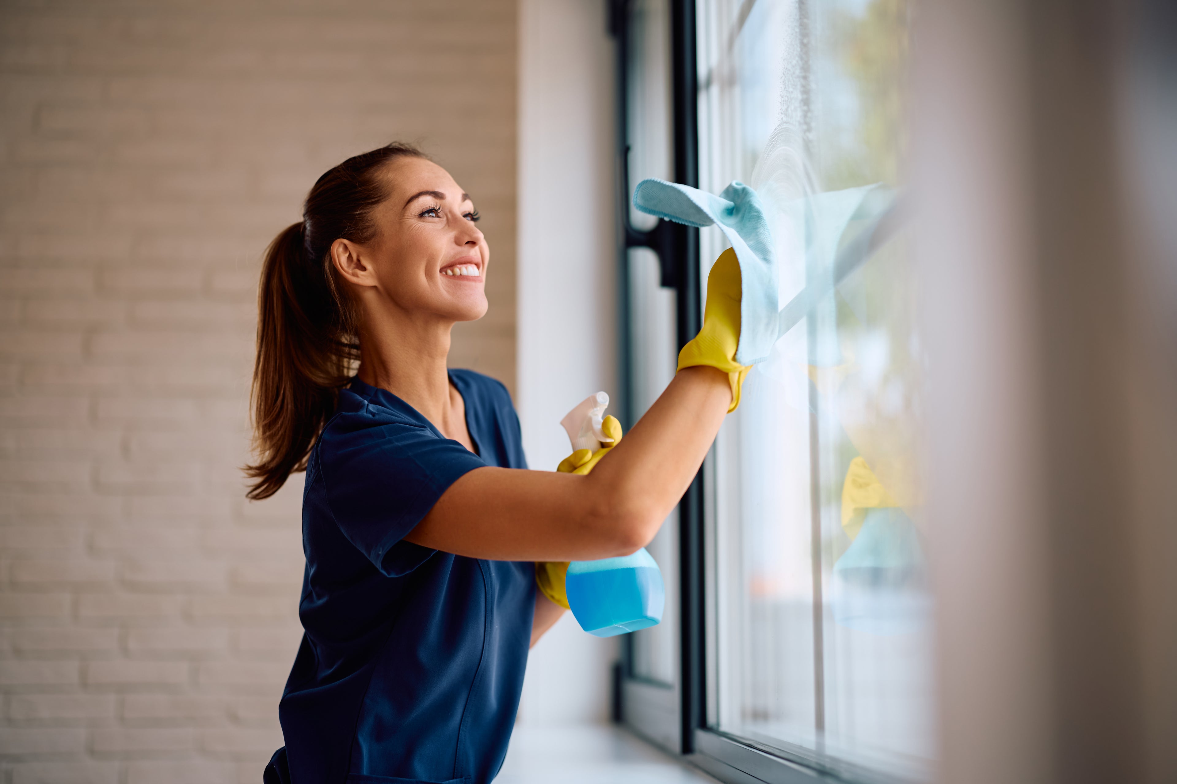 Woman cleaning windows